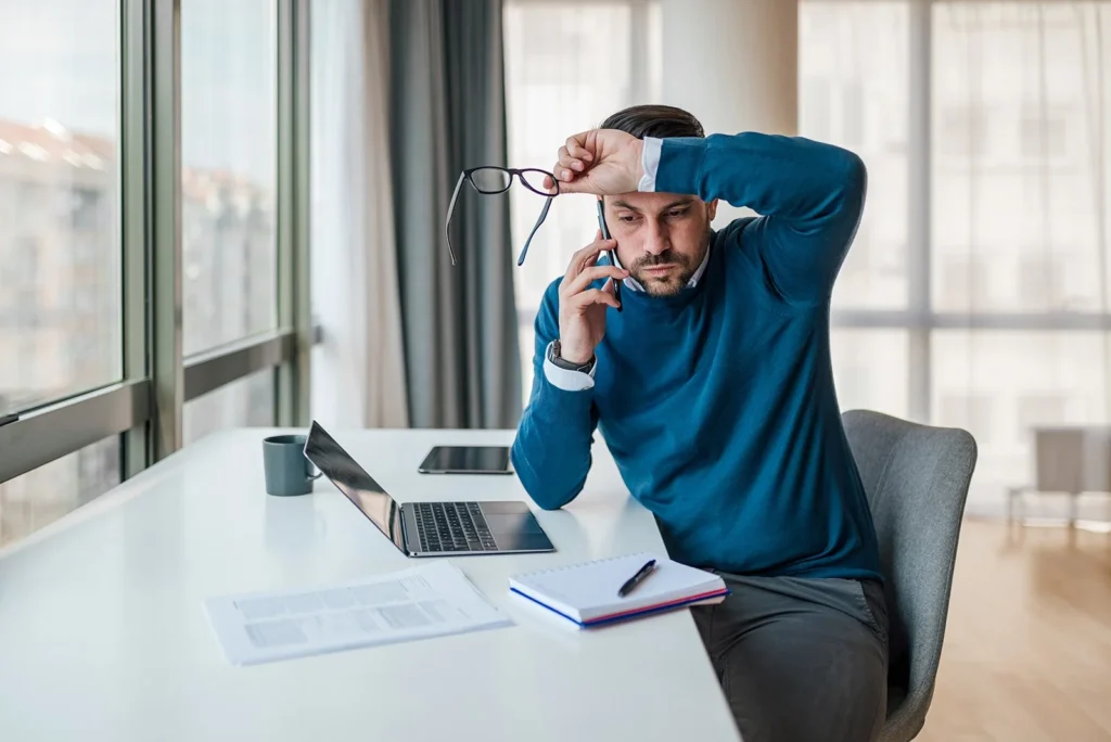 image of a client that can not decide and has their hand on their head