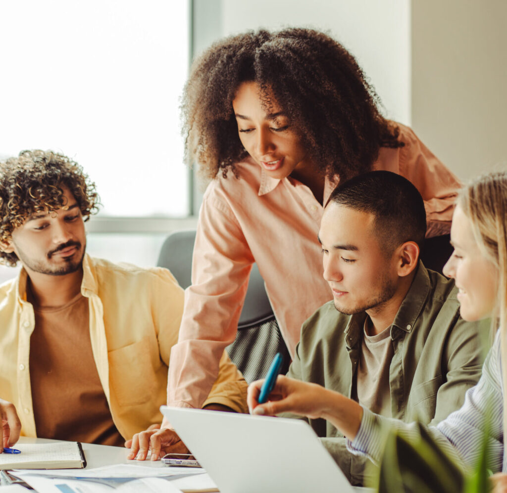 Call center sales team collaborating on performance metrics and scripts.