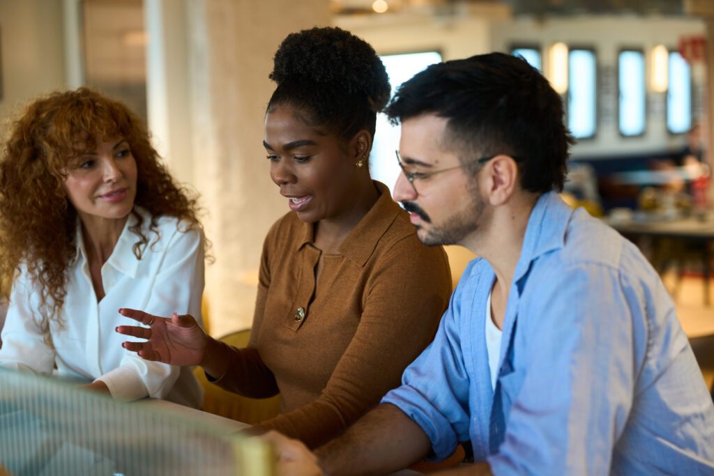 E-commerce sales professionals analyzing online sales data and building digital sales initiatives in a collaborative setting